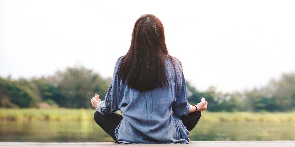 woman meditating for self care mental health